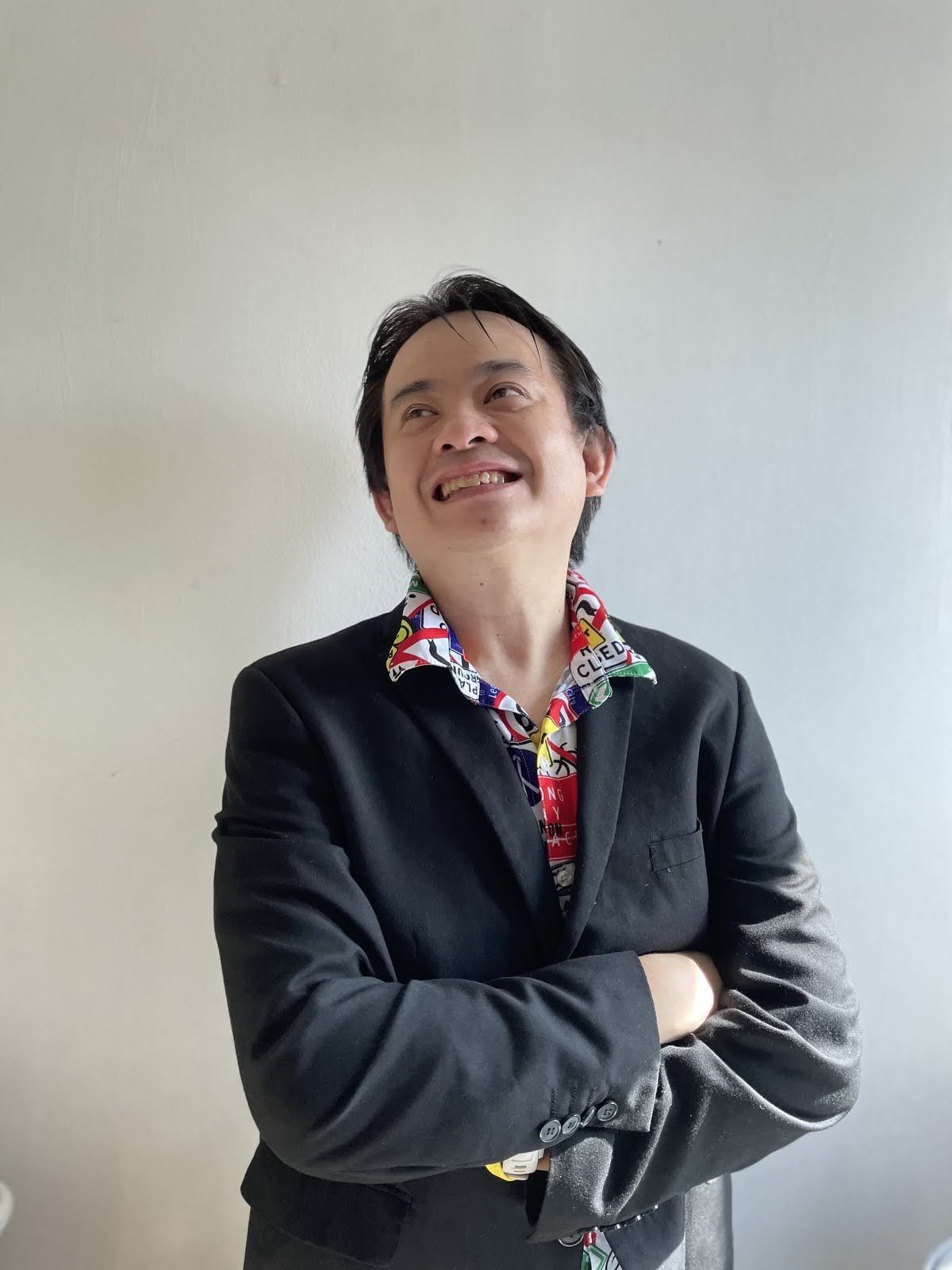Dann in colorful polo and suit
